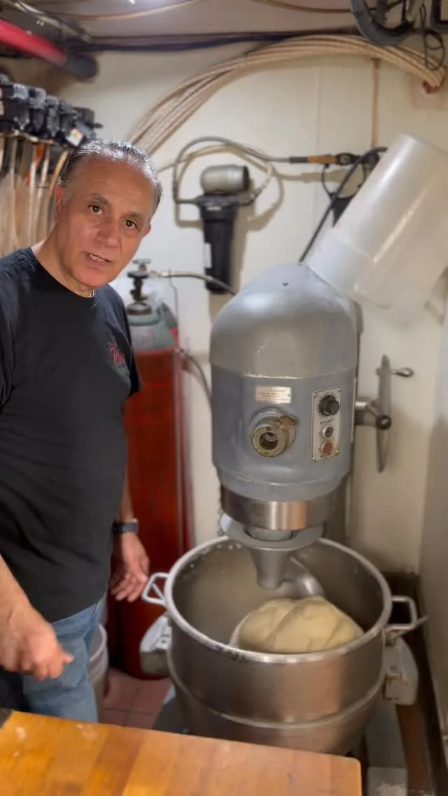 A member of the Rosa team in the pizzeria kitchen